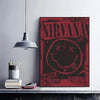 A vintage grunge poster featuring the word NIRVANA and LIVE with a distressed texture on a red background.
