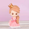 A figurine of a princess with a gold crown, wearing a pink dress and long brown hair, standing on a clear base.