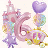 A set of seven pink balloons shaped like the number six, a castle, and a star for a birthday party.