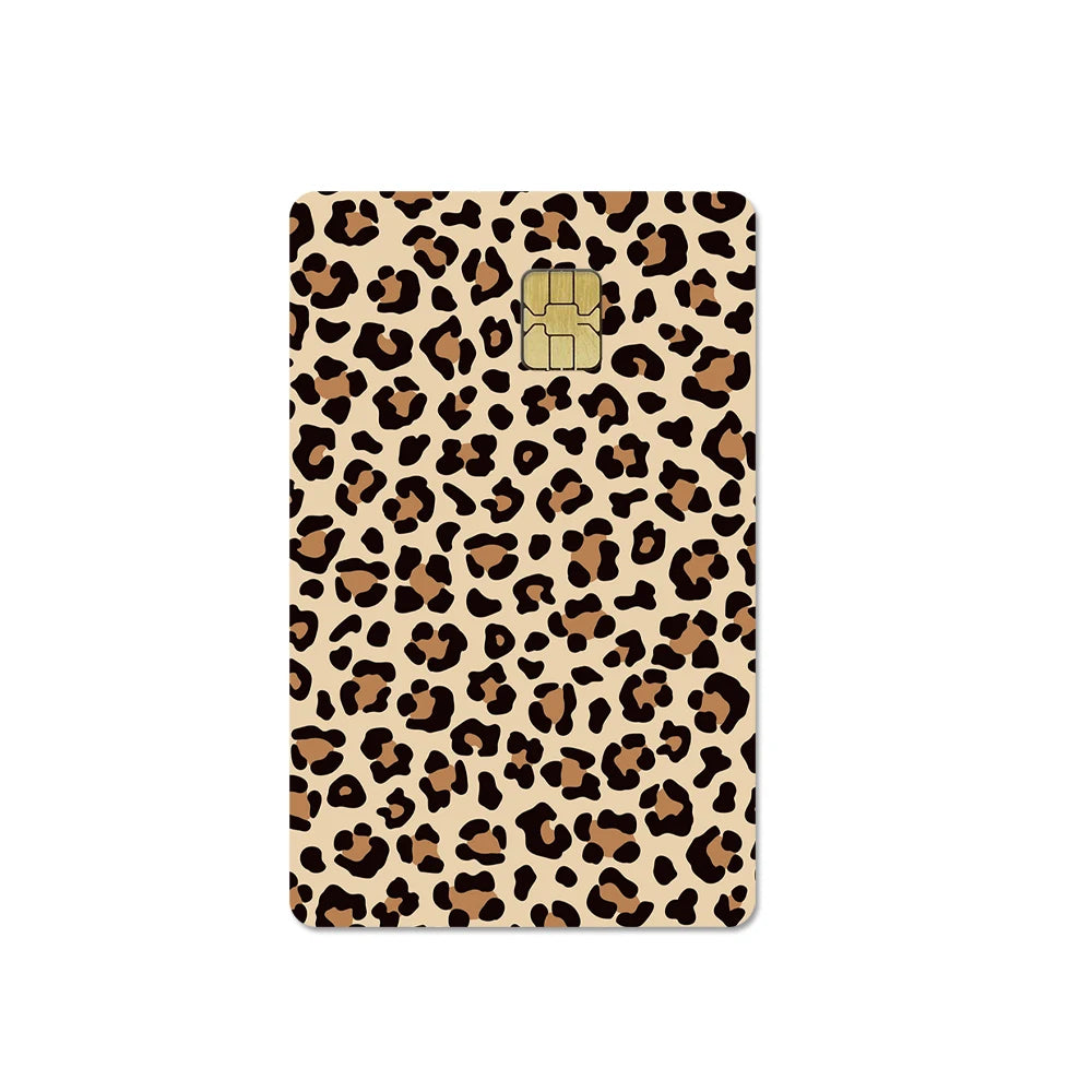 A card cover featuring a leopard print design with a gold-colored paw print emblem.