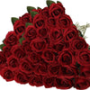 A dense bouquet of deep red velvet artificial roses for weddings and home decor.