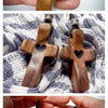Handcrafted walnut cross keychain in various wood tones and finishes