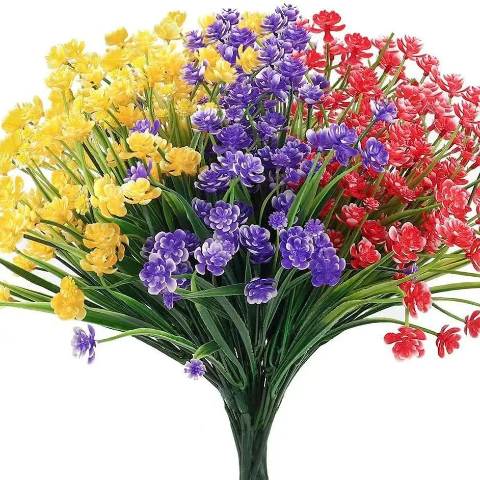 A vibrant bouquet of yellow, purple, and red artificial flowers and greenery for home and event decoration.