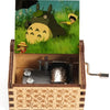 Hand-cranked wooden music box featuring a Totoro design set in a grassy landscape.