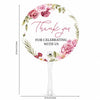 A circular pink floral thank you hand fan with the text Thank you for celebrating with us