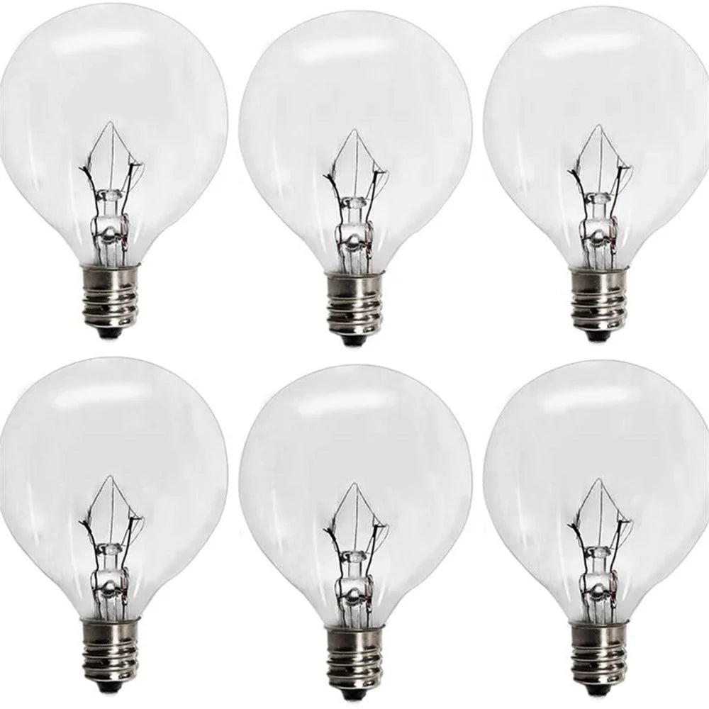 Six clear incandescent light bulbs with E12 candelabra bases shown in various angles
