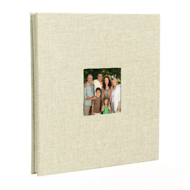 A beige linen front scrapbook memory book with a photo of a family.