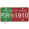 A vintage metal tin sign featuring the text THE CITY OF LISBON and the year 1910 on a green and red background with a coat of