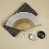 Traditional Bamboo Folding Fan with Solid Color Design