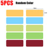 Five random colored magnetic dry erase labels or stickers in rectangular shapes.