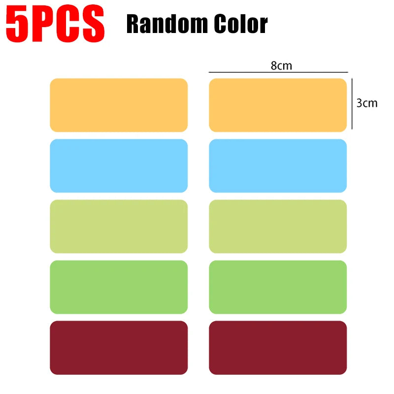 Five random colored magnetic dry erase labels or stickers in rectangular shapes.