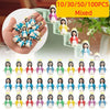 A collection of mixed mini Maria religious desktop figurines in various colors and outfits displayed on a staircase.