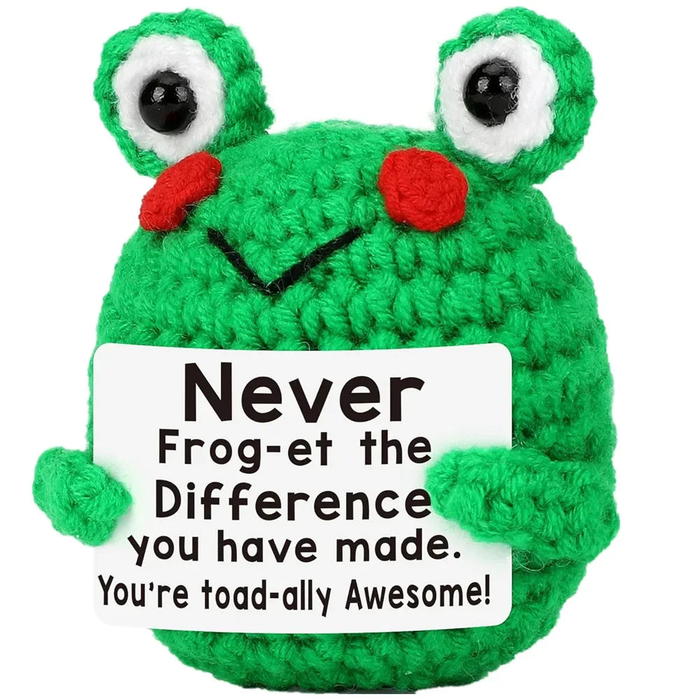 A bright green crochet frog ornament with large eyes and red accents.