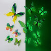 A set of twelve luminous green and yellow butterfly wall stickers displayed against a white and green background.