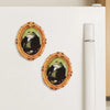 A vintage wooden frame with a painting of a gentleman frog is displayed on a white refrigerator.