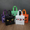 A collection of Halloween party treat bags featuring pumpkin and ghost designs in purple, green, black, and orange.