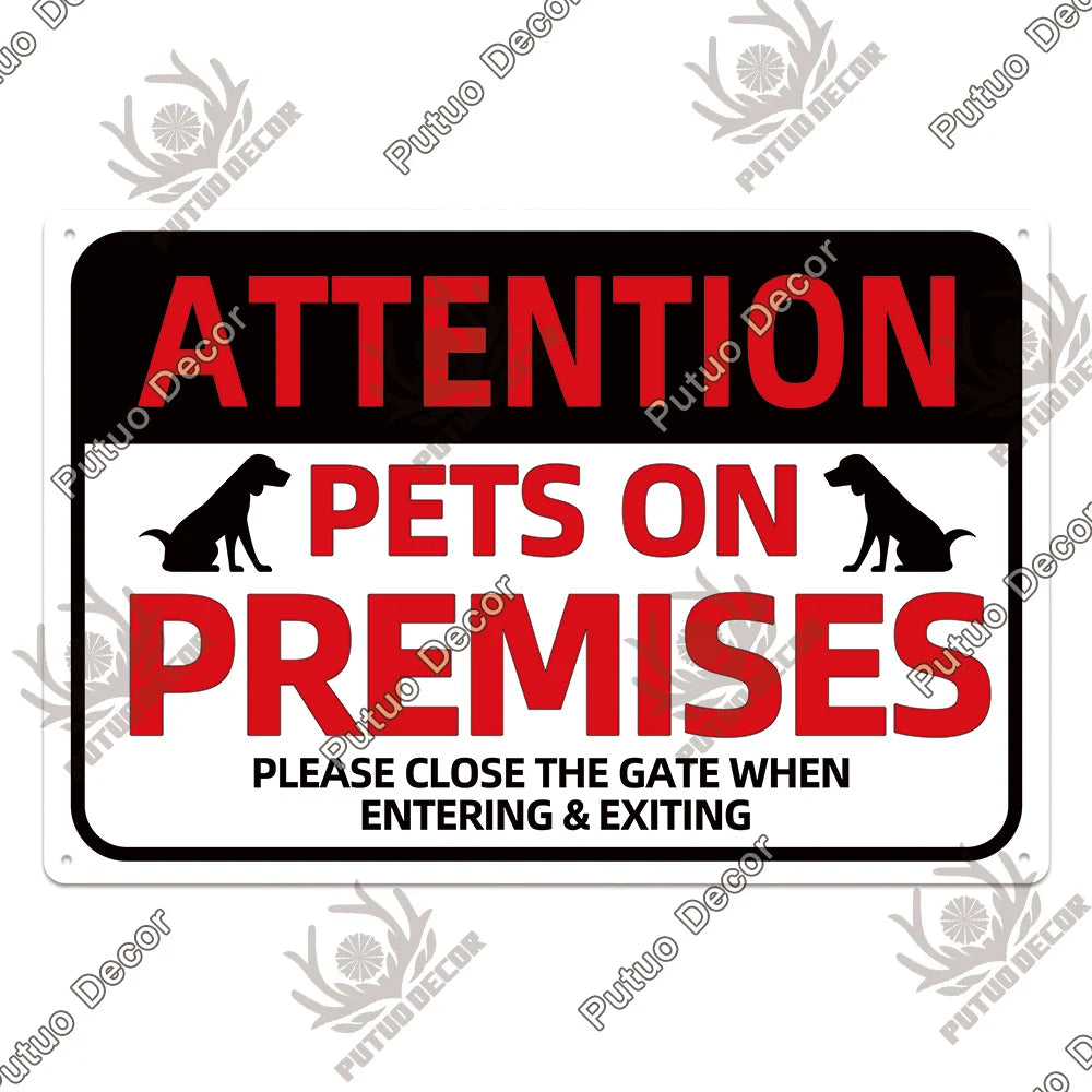A black and red warning sign with a silhouette of a dog, stating ATTENTION PETS ON PREMISES and instructions to close the gat
