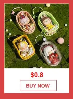 A collection of colorful ceramic food items and decorative elements arranged on green moss.