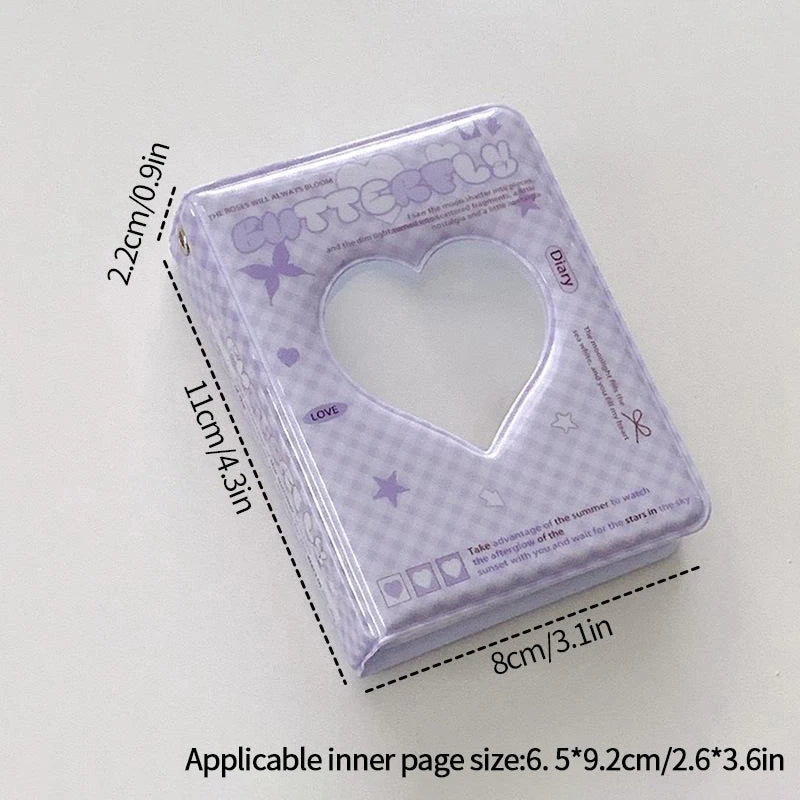A clear purple plastic photo card album binder with a heart-shaped window and measurements displayed.