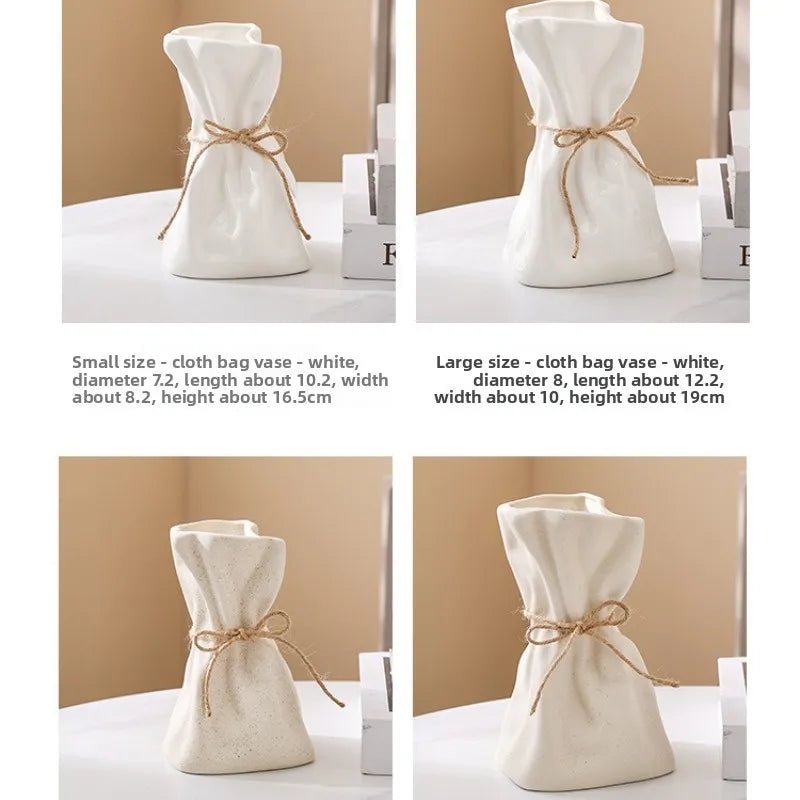A set of ceramic and glass money bag shaped vases for hydroponic plants, shown in white with gold string accents.