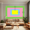 A living room setup featuring a sofa and a large framed tapestry with measurements.
