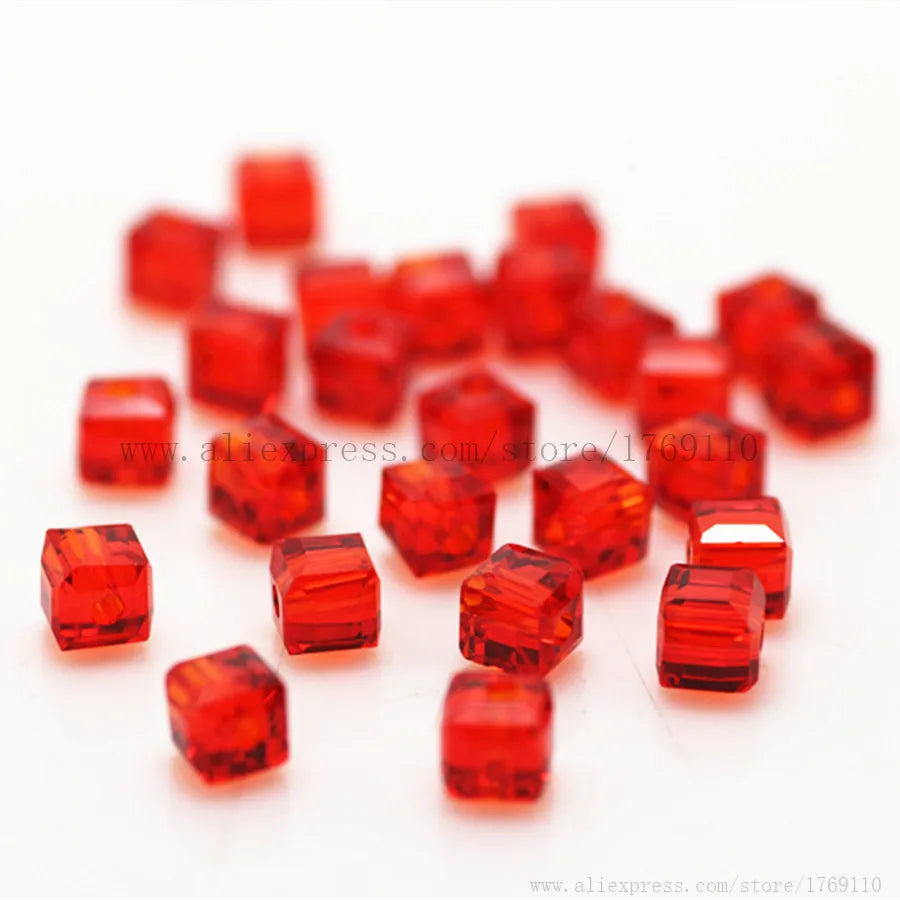 A pile of square cut red glass crystal beads for jewelry making
