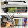 An advanced Epson machine with several printed canvases displayed on the surface.