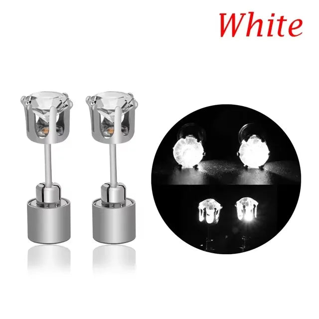 A pair of white LED light-up flashing stud earrings with color-changing zircon stones shown in a close-up view.
