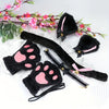 Black and pink cartoon cat paw gloves with decorative headband and floral greenery
