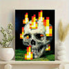 A digital art print featuring a pixelated skull engulfed in bright orange and yellow flames against a dark background.