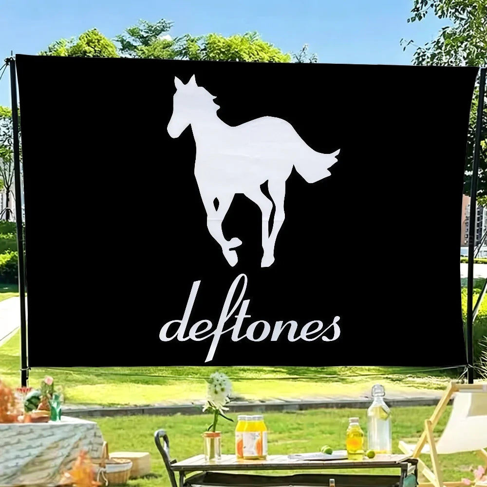 A black flag with a white silhouette of a horse and the word deftones printed in white text.