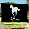 A black flag with a white silhouette of a horse and the word deftones printed in white text.