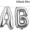 A banner spelling out BABY made of silver foil balloons