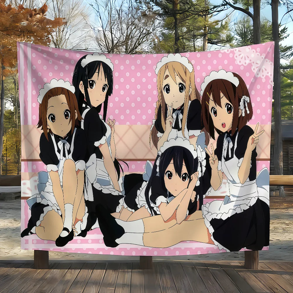 A pink tapestry featuring characters from K-On! anime in a casual pose.