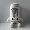 A white soft plush toy shaped like an energy drink can with a monster face and text.
