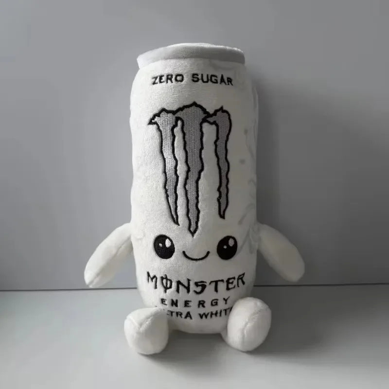 A white soft plush toy shaped like an energy drink can with a monster face and text.