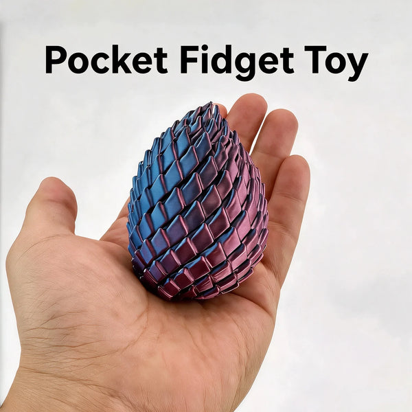 A hand holds a textured, iridescent purple and blue dragon egg fidget toy.