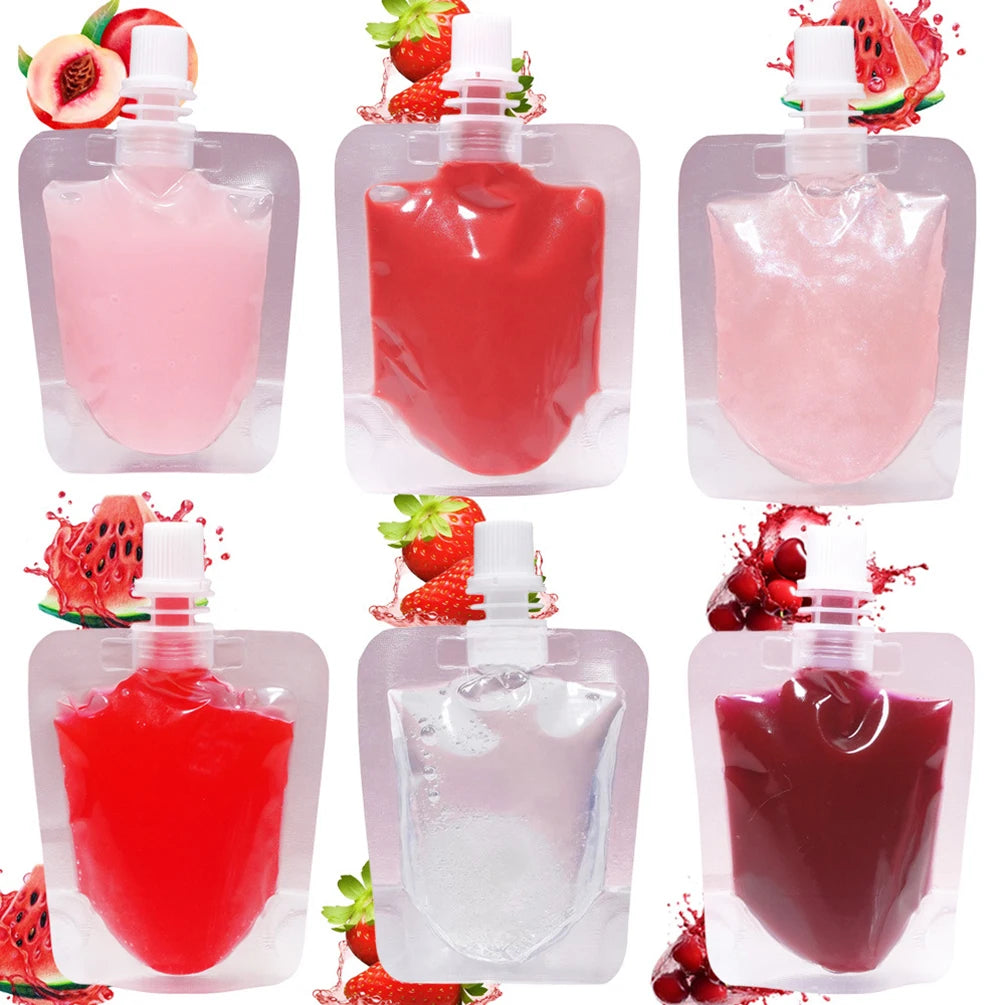 Various shades of fruit lip oil gloss products in clear plastic containers, including pink, red, and clear versions.