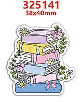 A stack of colorful books with pink, yellow, and blue spines, decorated with green foliage and bows.