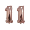 Two rose gold foil number balloons shaped like the number 1, used for birthday party decor.