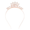A delicate rose gold tiara crown headband for a birthday celebration.