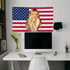 A woman with blonde hair is pictured against an American flag tapestry featuring red, white, and blue stripes and stars.