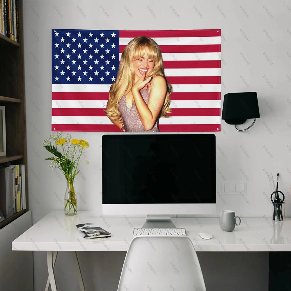 A woman with blonde hair is pictured against an American flag tapestry featuring red, white, and blue stripes and stars.