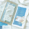 A collection of vintage old English manuscript decor paper featuring light blue and cream tones with lace accents.