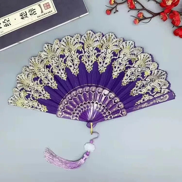 Elegant purple and gold folding fan with intricate traditional Chinese design