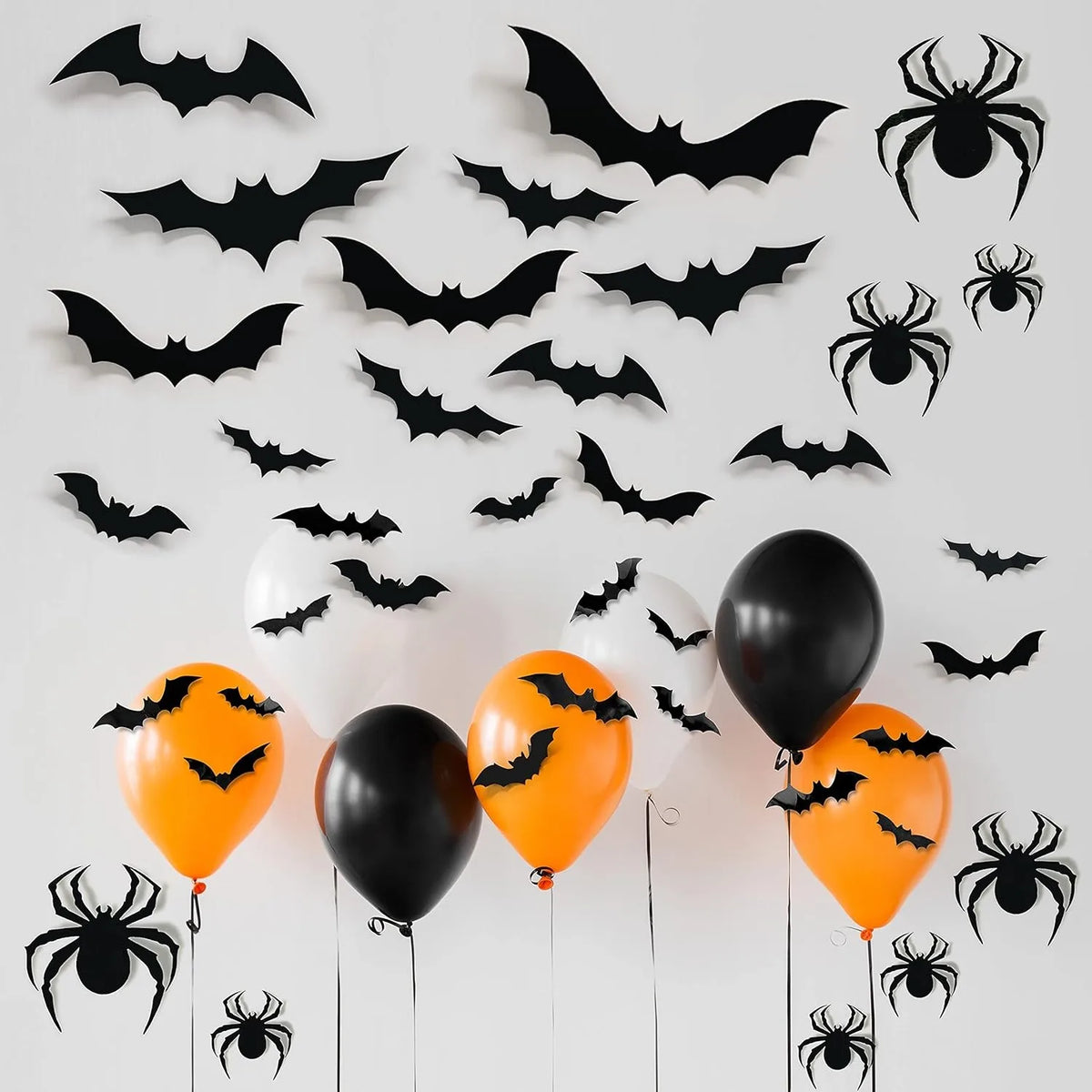 A collection of black bat and spider silhouettes used as wall stickers for Halloween décor.