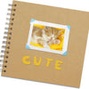 A brown scrapbook page features a photo of a sleeping kitten in a yellow frame.