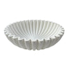 A white modern ruffle scalloped decorative bowl with deeply fluted sides.