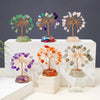 A display of seven chakra healing crystal trees featuring natural stones in various colors and textures.