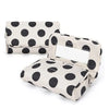 A portable canvas makeup bag with a mirror featuring a black polka dot pattern on a light background.